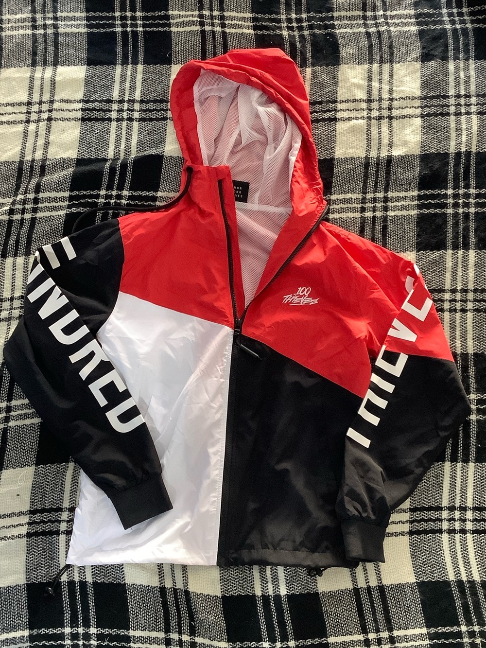 100 thieves black, red, and white windbreaker jacket